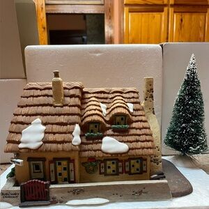 Christmas Carol Cottage with Snow and Brown Roof Home of Bob and Mary Chratchit